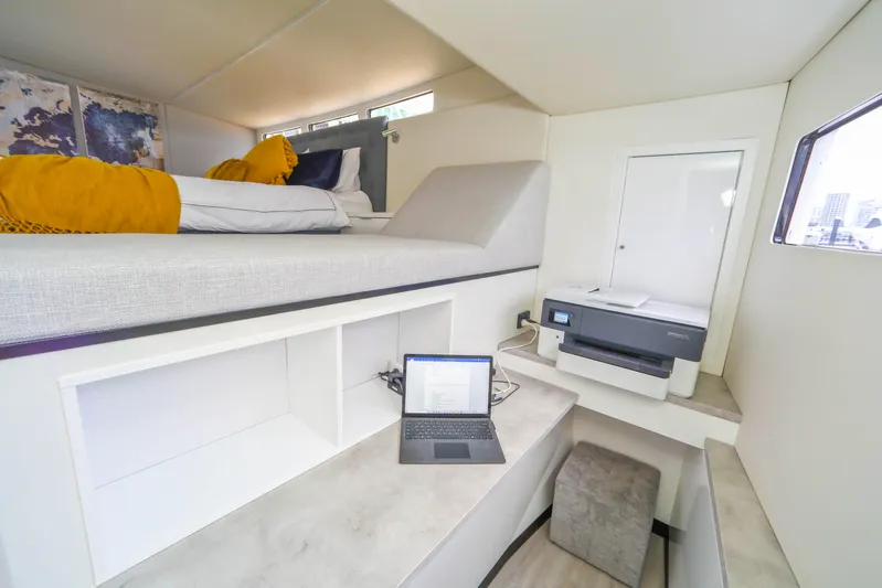  Yacht Photos Pics Modern Sunpower 44 VIP yacht interior with bed, workspace, and printer, 2022 model.