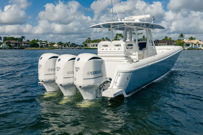  Yacht Photos Pics 2015 Intrepid 375 Center Console boat with triple Yamaha engines on water.