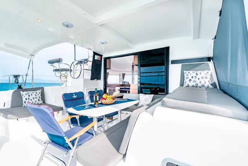  Yacht Photos Pics Luxurious 2018 Lagoon 42 catamaran interior with seating, table, and ocean view.