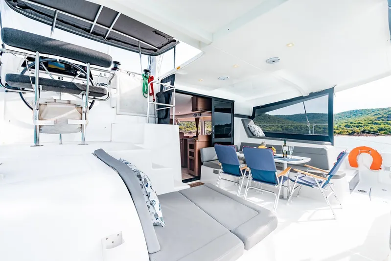  Yacht Photos Pics Luxurious 2018 Lagoon 42 catamaran interior with seating, dining area, and scenic views.