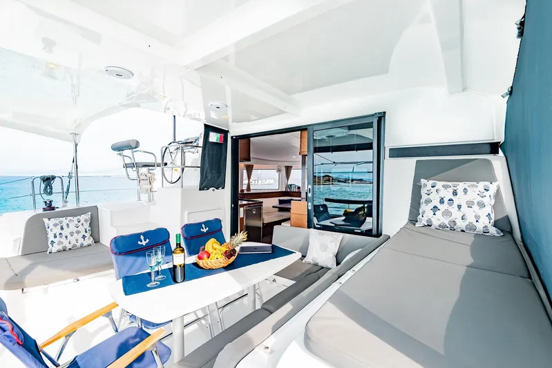  Yacht Photos Pics Luxurious 2018 Lagoon 42 yacht interior with dining area, lounge, and ocean view.