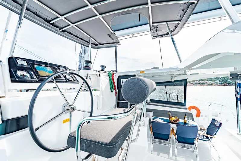  Yacht Photos Pics Helm and seating area of 2018 Lagoon 42 catamaran with ocean view.