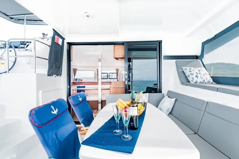  Yacht Photos Pics Luxurious 2018 Lagoon 42 yacht interior with dining area, wine, and ocean view.