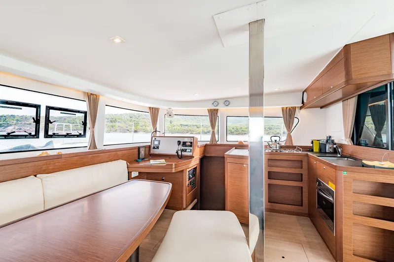  Yacht Photos Pics Interior of 2018 Lagoon 42 catamaran with modern kitchen and dining area.