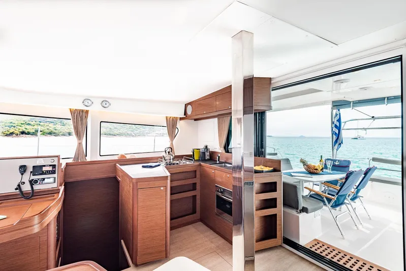  Yacht Photos Pics Interior of 2018 Lagoon 42 yacht with modern kitchen and ocean view.