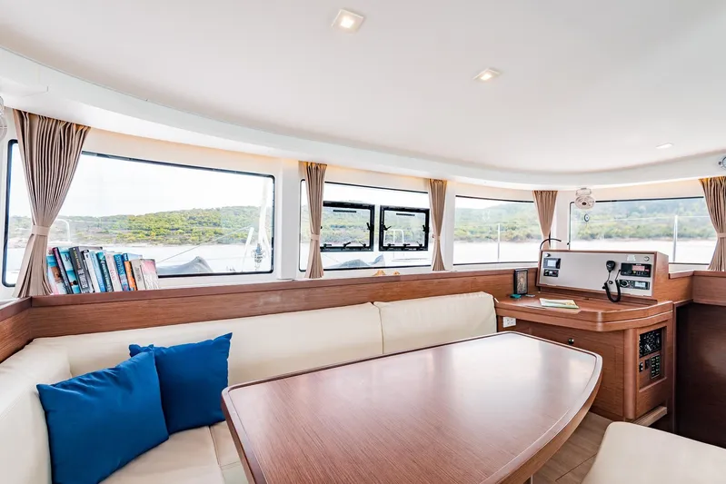  Yacht Photos Pics Interior of 2018 Lagoon 42 yacht with modern seating and navigation area.