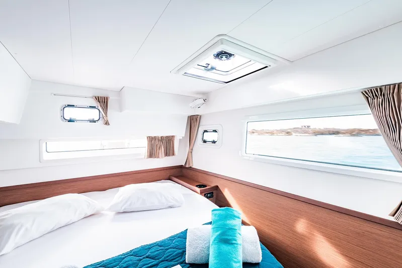  Yacht Photos Pics Luxurious cabin interior of 2018 Lagoon 42 catamaran with ocean view and modern design.