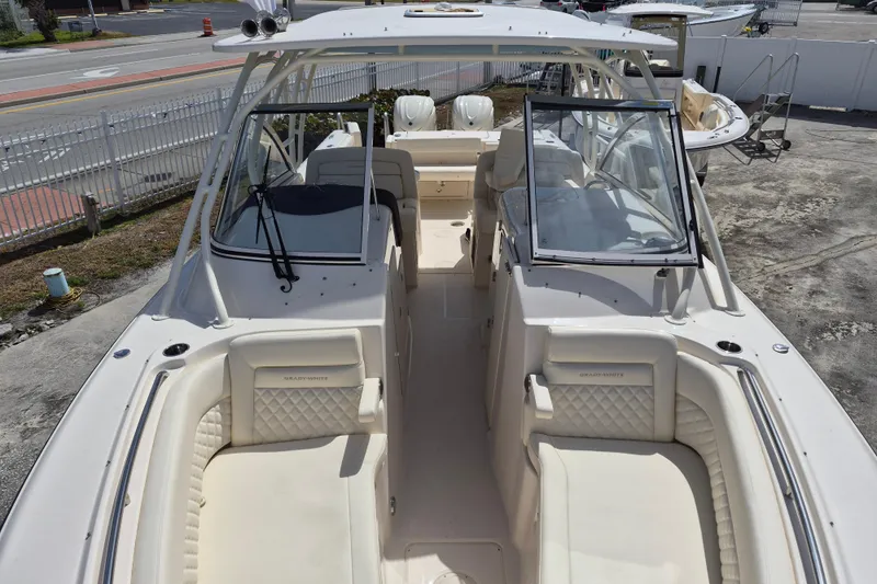306 - 628 Yacht Photos Pics 2026 Grady-White Freedom 307 boat interior with seating and windshield, parked outdoors.