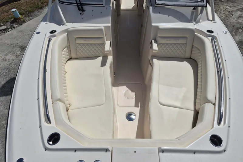 306 - 628 Yacht Photos Pics 2026 Grady-White Freedom 307 boat interior with cushioned seating and sleek design.