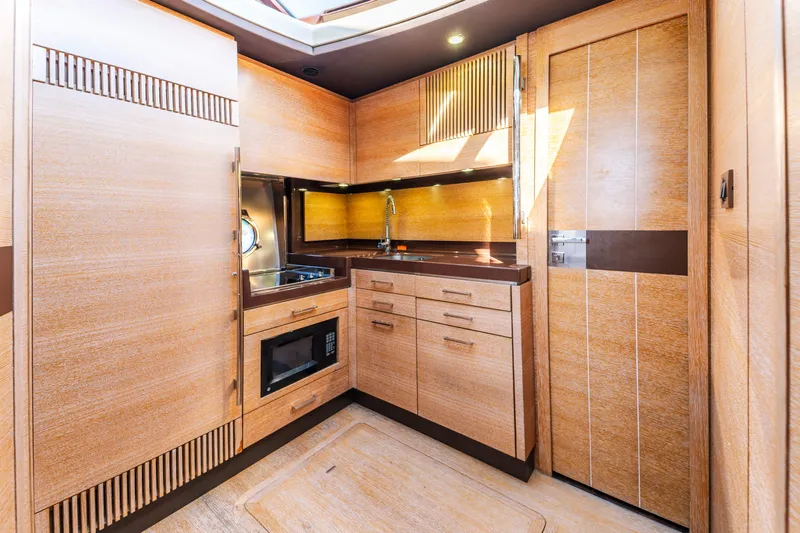 Prime Time Yacht Photos Pics Luxurious wooden kitchen interior of 2012 Azimut 48 Flybridge yacht.