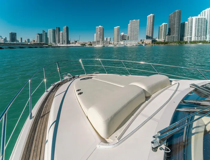 Prime Time Yacht Photos Pics 2012 Azimut 48 Flybridge yacht with city skyline in the background.