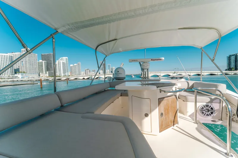 Prime Time Yacht Photos Pics Luxurious 2012 Azimut 48 Flybridge yacht with city skyline and marina views.