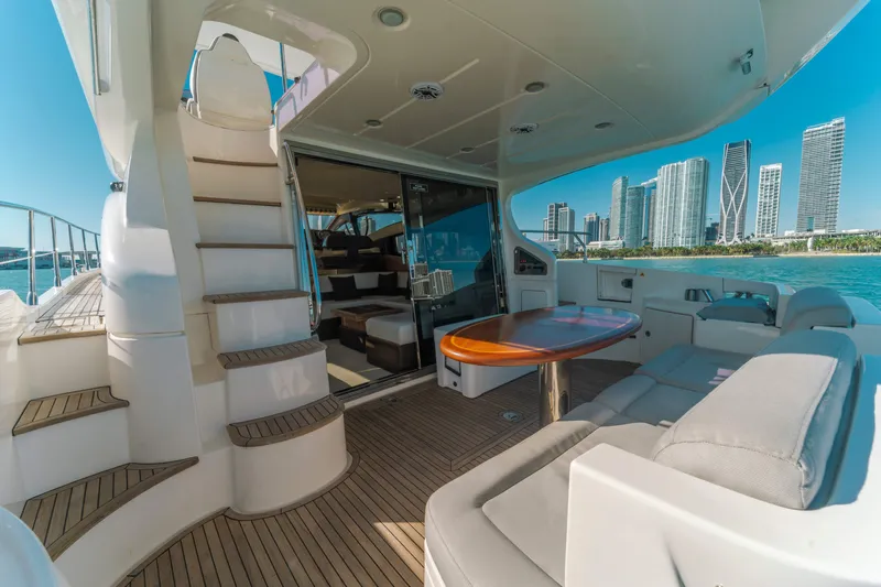 Prime Time Yacht Photos Pics 2012 Azimut 48 Flybridge yacht with spacious deck, city skyline view.