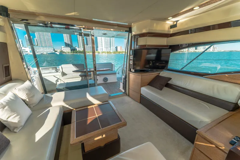 Prime Time Yacht Photos Pics Luxurious interior of 2012 Azimut 48 Flybridge yacht with cityscape view.