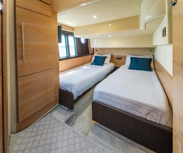 Prime Time Yacht Photos Pics Luxurious twin bedroom on 2012 Azimut 48 Flybridge yacht with modern wood finishes.