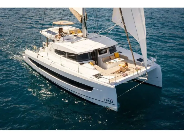 After You Yacht Photos Pics 2023 Bali 4.2 catamaran sailing on blue ocean waters.