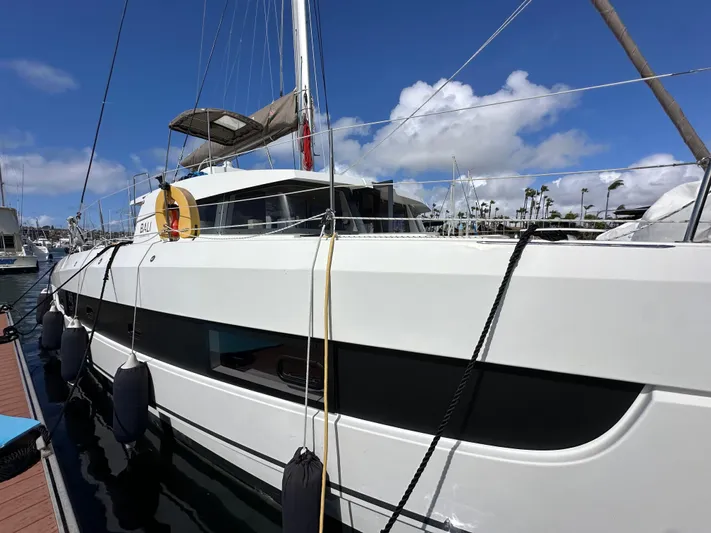 After You Yacht Photos Pics 2023 Bali 4.2 catamaran docked at marina under clear blue sky.