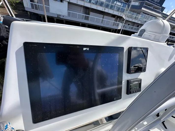 After You Yacht Photos Pics Control panel of 2023 Bali 4.2 yacht with navigation screens and instruments.