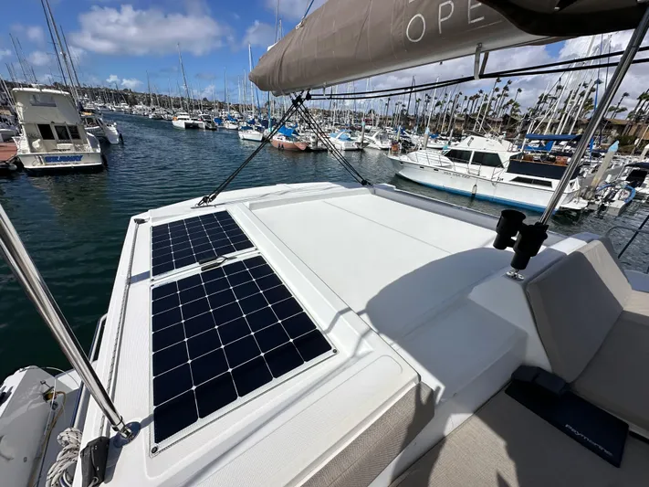 After You Yacht Photos Pics 2023 Bali 4.2 yacht with solar panels docked in a marina.