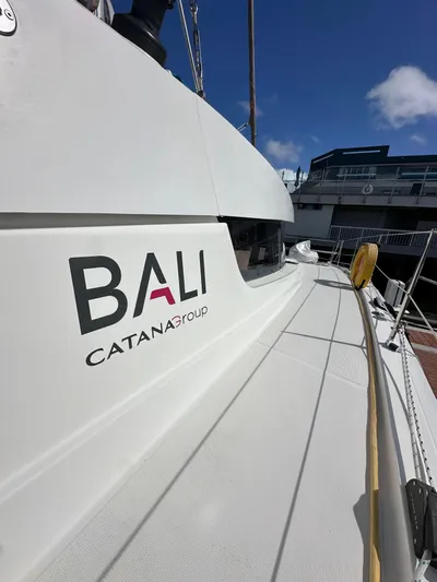 After You Yacht Photos Pics 2023 Bali 4.2 catamaran by Catana Group docked under a clear blue sky.