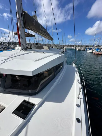 After You Yacht Photos Pics 2023 Bali 4.2 yacht docked in a marina under a clear blue sky.