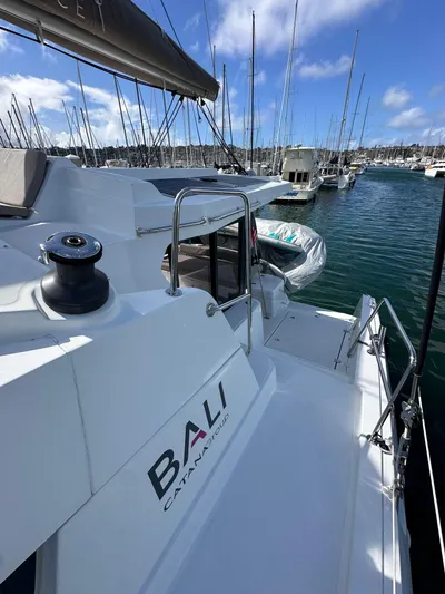 After You Yacht Photos Pics 2023 Bali 4.2 catamaran docked in marina, clear sky, calm water.