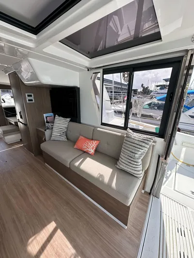 After You Yacht Photos Pics Interior of 2023 Bali 4.2 yacht, featuring modern seating and large windows.