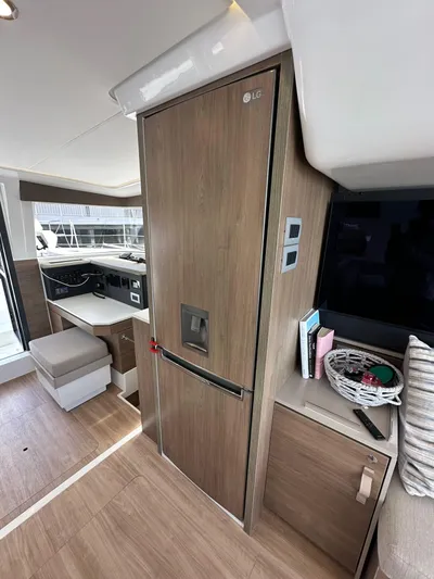 After You Yacht Photos Pics Interior of a 2023 Bali 4.2 yacht featuring modern kitchen and seating area.