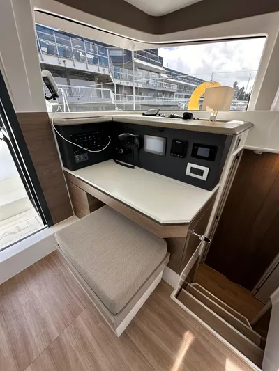 After You Yacht Photos Pics 2023 Bali 4.2 yacht interior helm station with navigation controls and seating.