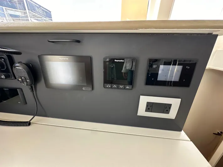 After You Yacht Photos Pics Control panel of 2023 Bali 4.2 yacht with navigation and communication devices.