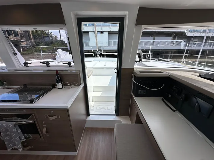 After You Yacht Photos Pics Interior of 2023 Bali 4.2 yacht, featuring modern kitchen and navigation area.