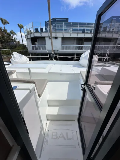 After You Yacht Photos Pics 2023 Bali 4.2 yacht deck view with open doors and modern design.