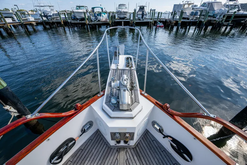  Yacht Photos Pics Bow view of 2002 Grand Banks 42 Classic yacht docked at marina.
