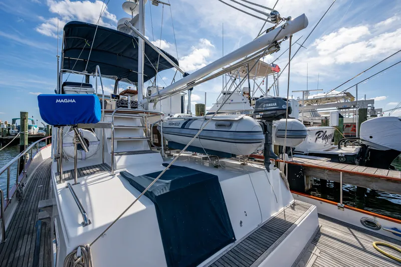  Yacht Photos Pics Grand Banks 42 Classic yacht, 2002 model, docked with inflatable dinghy on deck.