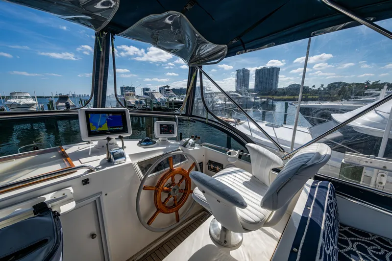 Yacht Photos Pics Cockpit of 2002 Grand Banks 42 Classic yacht with marina view.