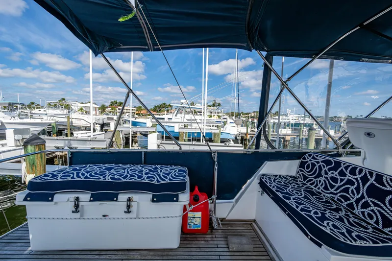  Yacht Photos Pics 2002 Grand Banks 42 Classic yacht interior with patterned seating, docked at marina.