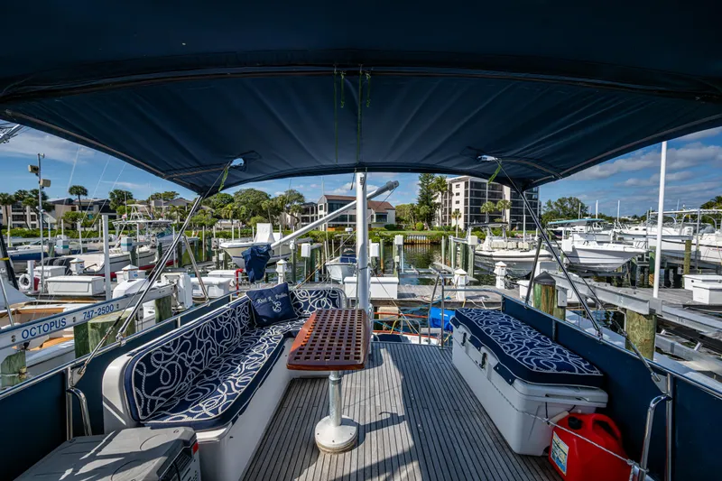  Yacht Photos Pics 2002 Grand Banks 42 Classic yacht interior with seating area and marina view.