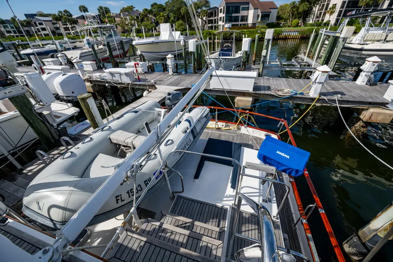  Yacht Photos Pics Grand Banks 42 Classic 2002 yacht docked with inflatable boat on deck.