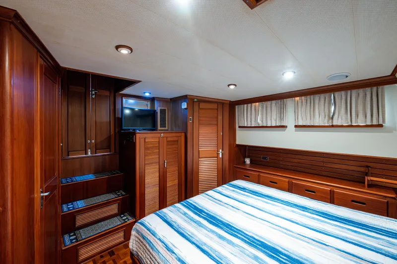  Yacht Photos Pics Luxurious cabin interior of 2002 Grand Banks 42 Classic yacht with wood finish.