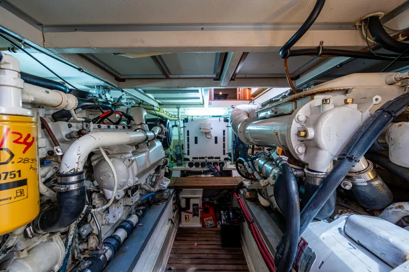 Yacht Photos Pics Engine room of 2002 Grand Banks 42 Classic yacht, showcasing dual engines and mechanical systems.