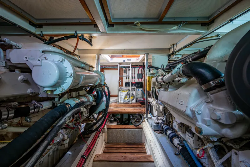  Yacht Photos Pics Engine room of a 2002 Grand Banks 42 Classic yacht, showcasing mechanical components.