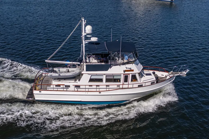  Yacht Photos Pics 2002 Grand Banks 42 Classic yacht cruising on open water.