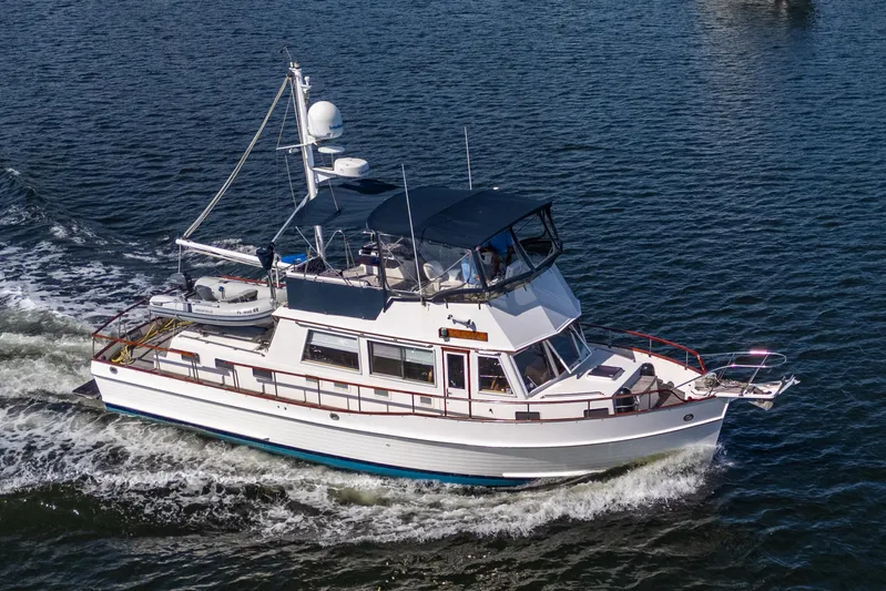  Yacht Photos Pics 2002 Grand Banks 42 Classic yacht cruising on open water.