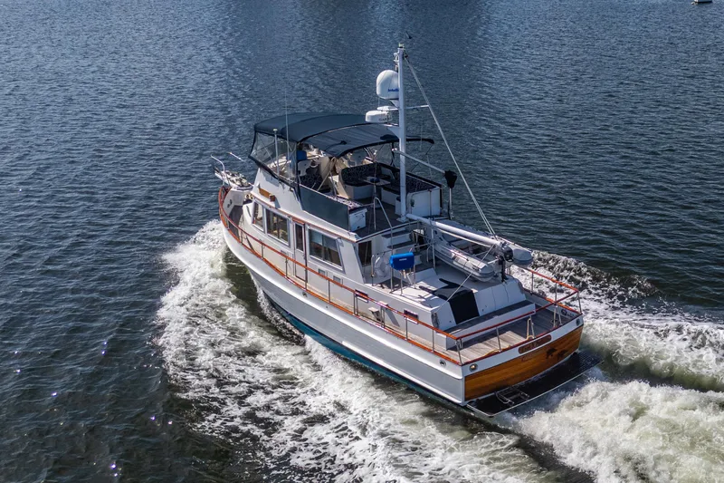  Yacht Photos Pics 2002 Grand Banks 42 Classic yacht cruising on open water.