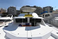 2017 Leopard 51 Powercat yacht docked in marina, surrounded by urban buildings.