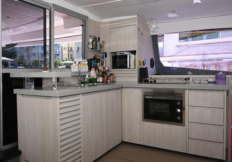  Yacht Photos Pics Modern kitchen interior on 2017 Leopard 51 Powercat yacht with appliances and sleek cabinetry.