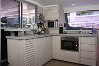 Modern kitchen interior on 2017 Leopard 51 Powercat yacht with appliances and sleek cabinetry.