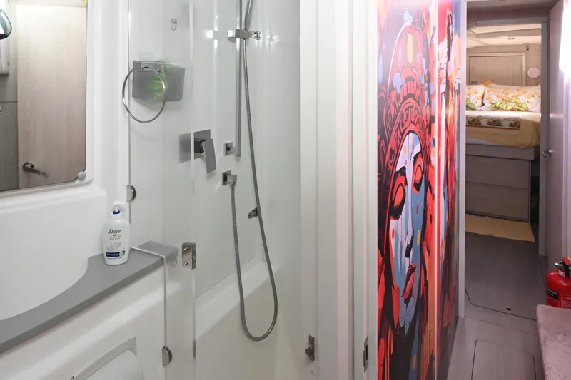  Yacht Photos Pics Interior of 2017 Leopard 51 Powercat featuring modern bathroom and vibrant wall art.