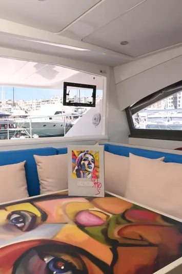  Yacht Photos Pics Leopard 51 Powercat 2017 interior with colorful artwork and marina view.