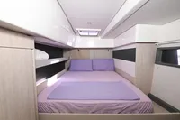 Cabin interior of 2017 Leopard 51 Powercat with a neatly made bed and modern design.